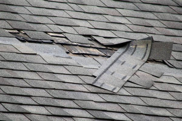 damaged roof shingles needs repair