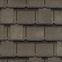 Close-up of a gray asphalt shingle roof texture.