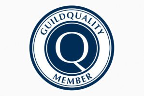 A blue and white logo for the guild quality member.