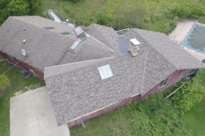 A bird 's eye view of a house with a roof that has been cut off.
